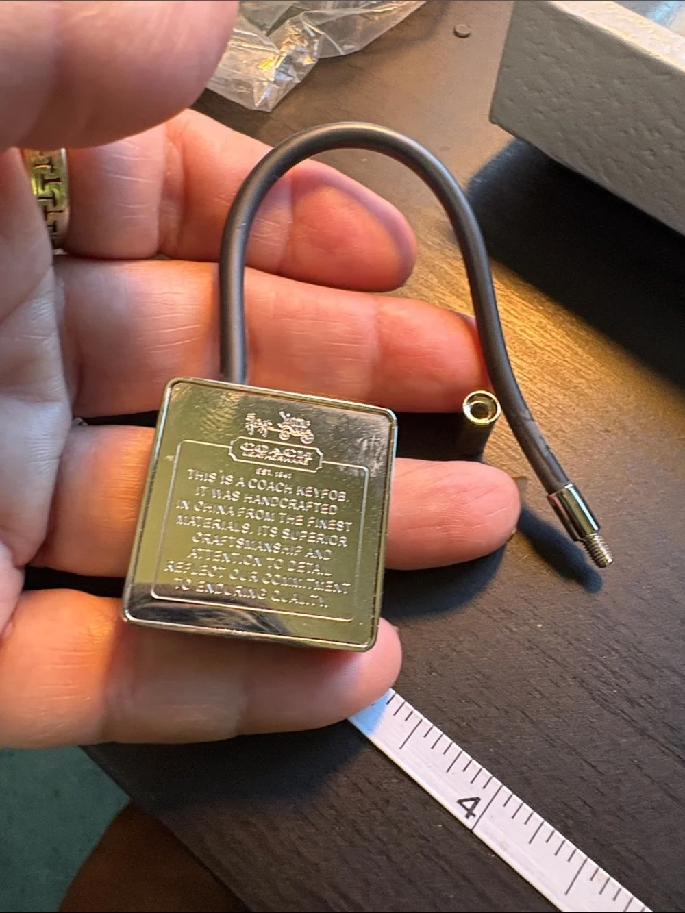 Coach Silver Creed Keychain with Black Pen.